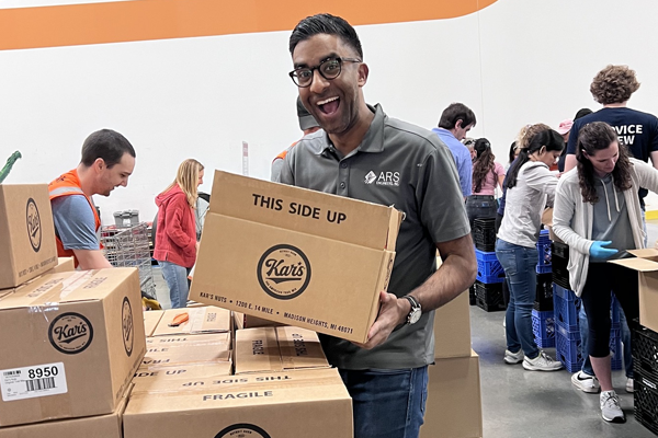 Image of Marc Sandhu volunteering at a TSPE Dallas Food Bank Event